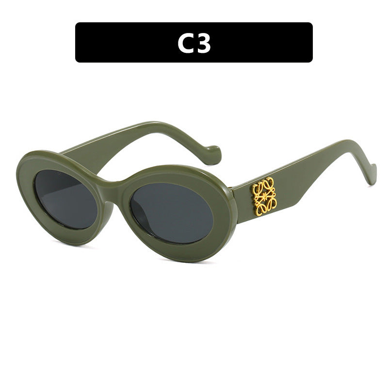 Women's fashionable sunglasses with oval frame and golden accents Bowlift