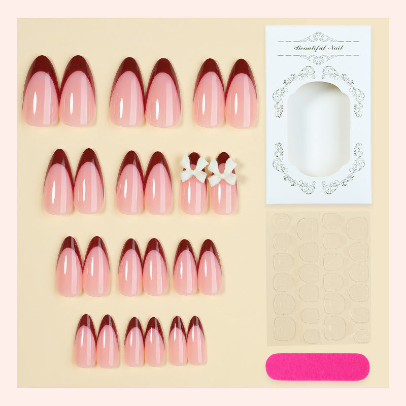 Acrylic nail set with creative French tip design and cute bows Bowlift