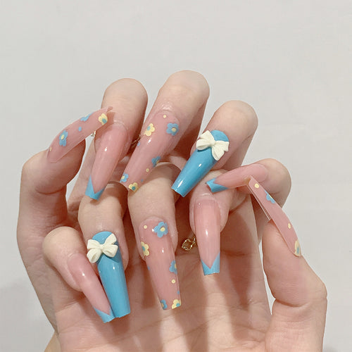Artistic and playful nail extensions with floral patterns Bowlift
