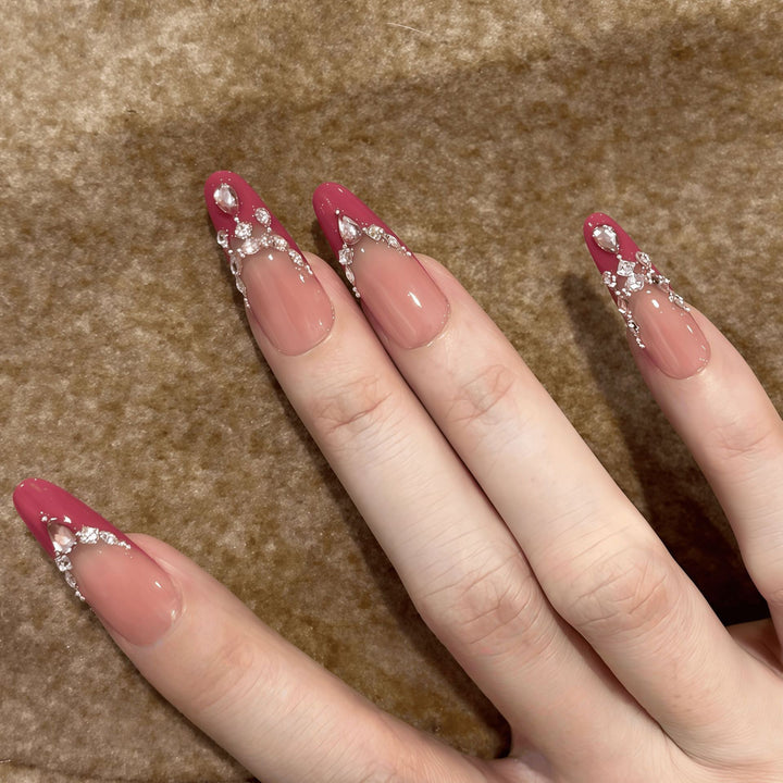Artificial nails with sparkling rhinestone accents Bowlift