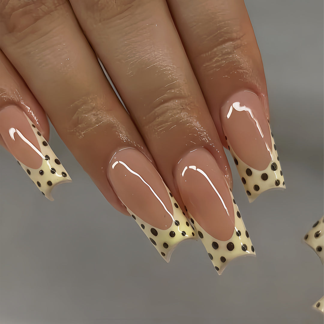 Artistic Long Nail Extensions with Polka Dot Design Bowlift