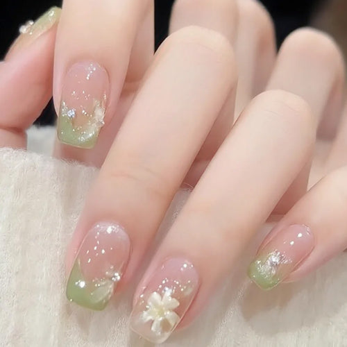 Artificial nails with floral accents and glitter coating Bowlift