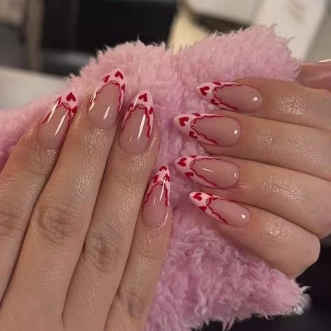 Acrylic nail set with elegant heart tips and creative accents Bowlift