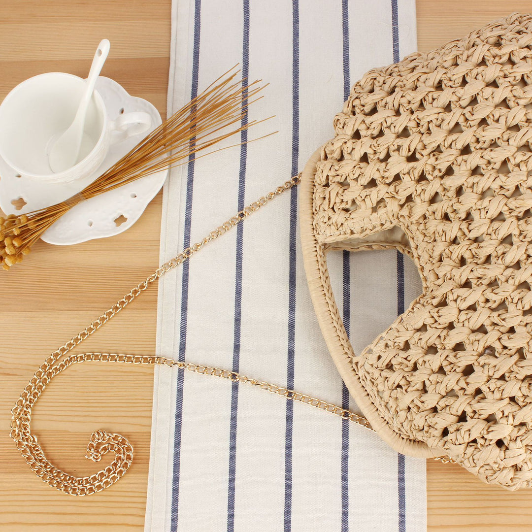 Fine straw shoulder bag with elegant chain accents Bowlift