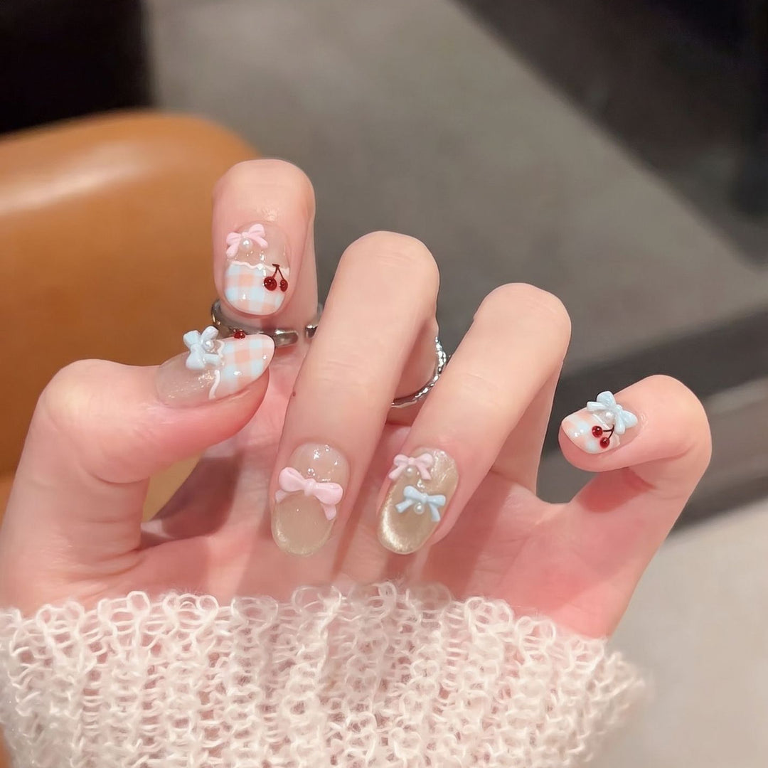 Decorative Press-On Nail Art Set with Charming Bow and Cherry Accents Bowlift