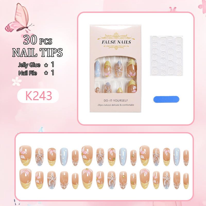 Artificial nails with floral motifs and glitter details Bowlift