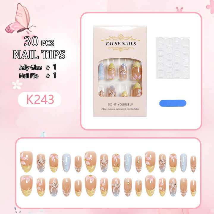 Artificial nails with floral motifs and glitter details Bowlift