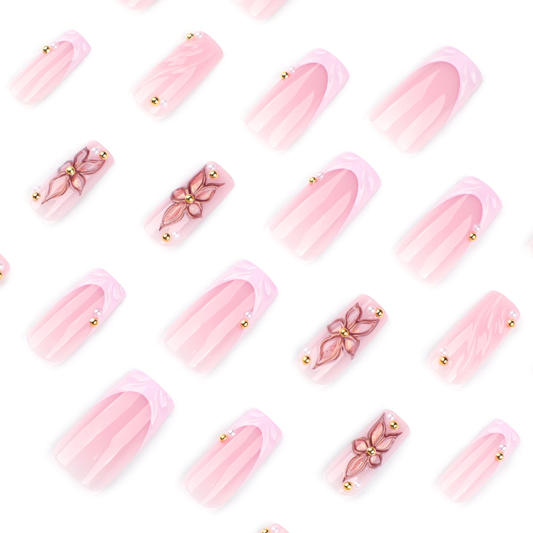 Artistic acrylic nails with flower design and glitter variations Bowlift