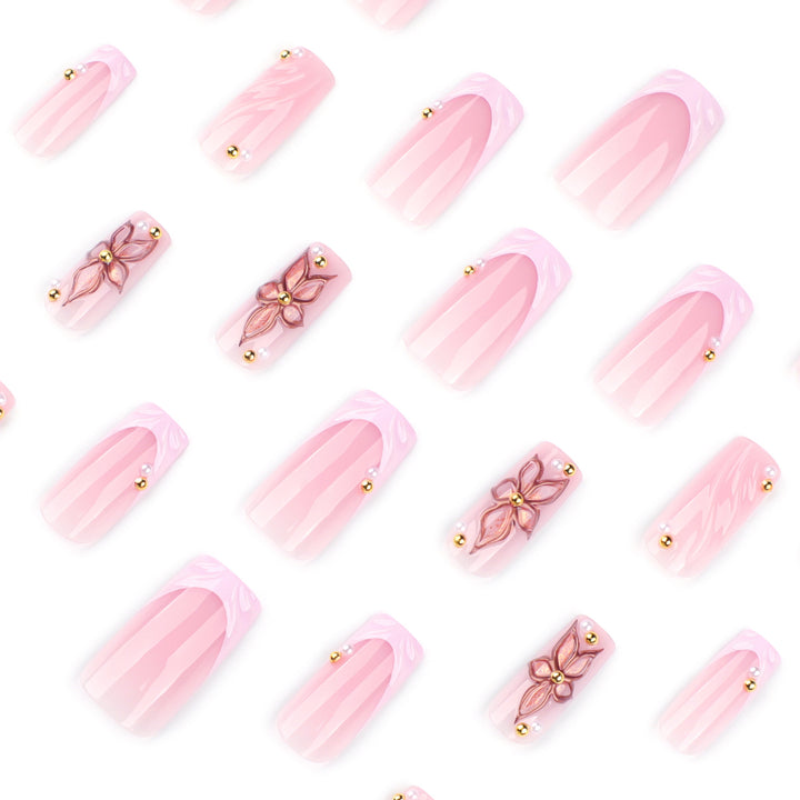 Artistic acrylic nails with flower design and glitter variations Bowlift