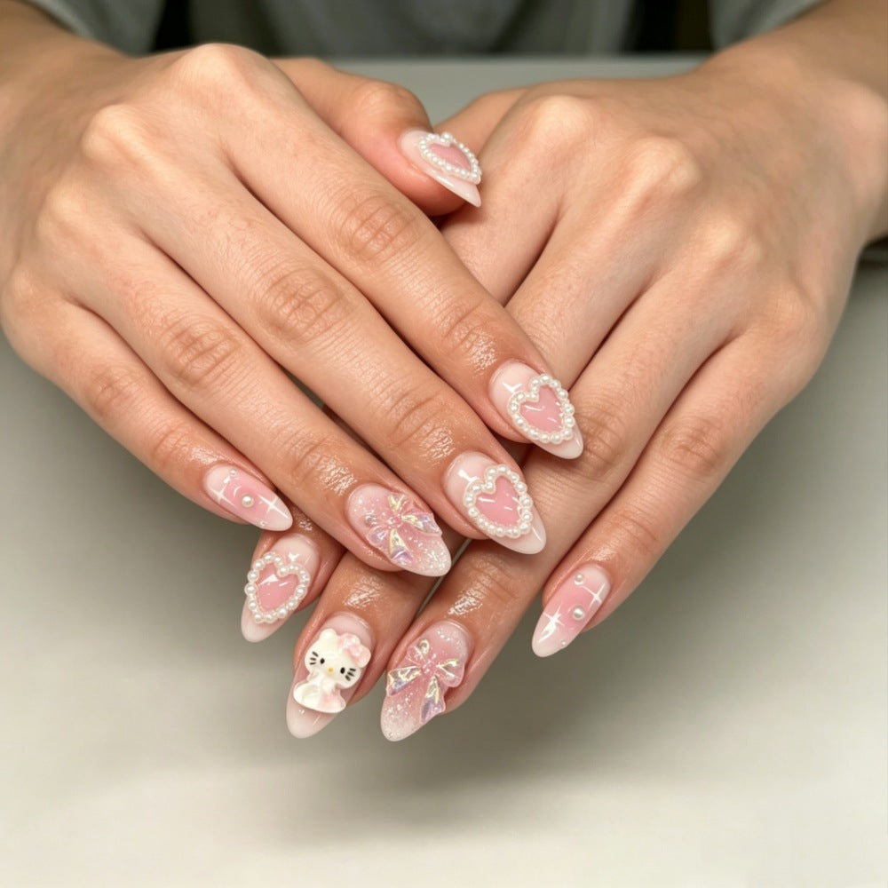 Playful artificial nails with heart and kitty motifs Bowlift