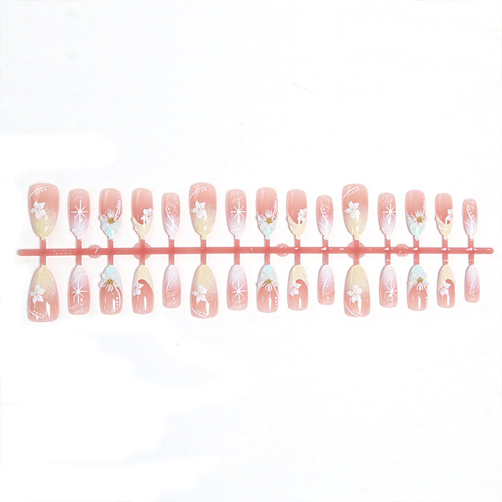 Artificial nail set with intricately detailed floral designs and shine accents Bowlift