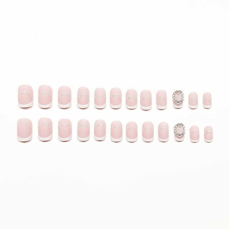 Artificial nail set with elegant French design and rhinestone embellishments Bowlift