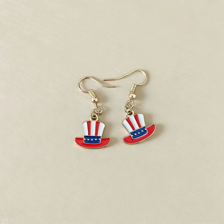 Women's handcrafted tassel earrings with flag medallion and pearl fringes Bowlift