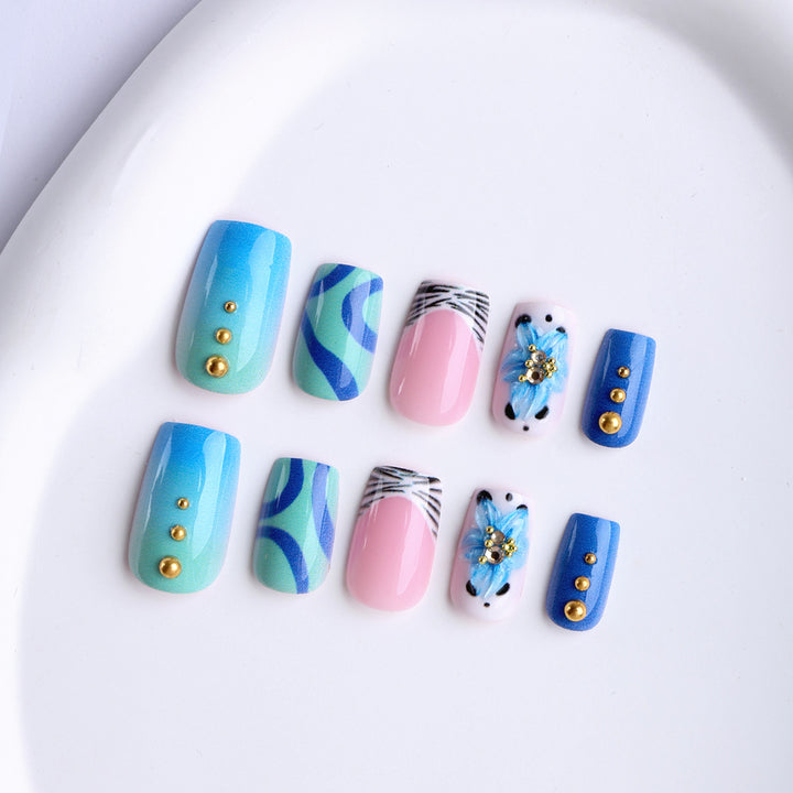 Artificial fingernails with handcrafted designs Bowlift