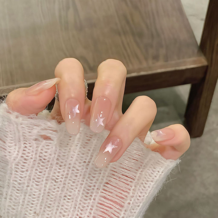 Artificial nails with sparkling stars and gentle gradient Bowlift