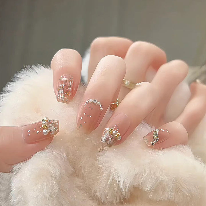 Artistic Press-On Nail Set with Glittery Star Accents Bowlift