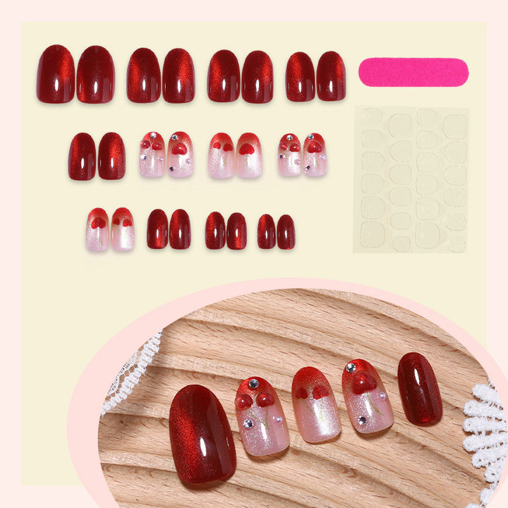 Artificial nail set with glamorous accents and creative heart motifs Bowlift