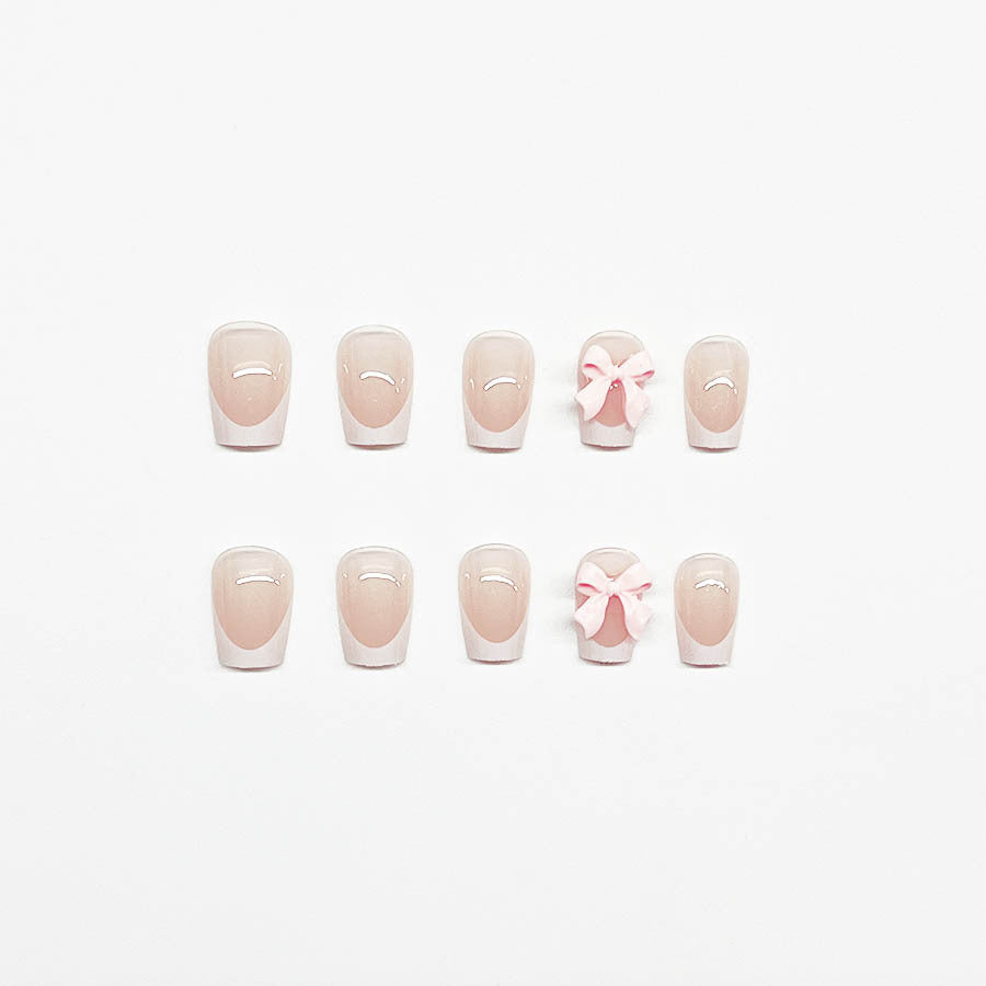 Decorative French Tip Nail Extensions with Bow Accents Bowlift