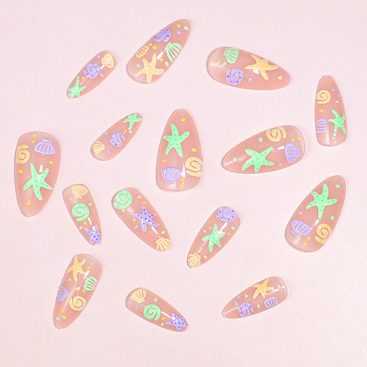 Artistic Press-On Nail Design with Ocean-Inspired Accents Bowlift