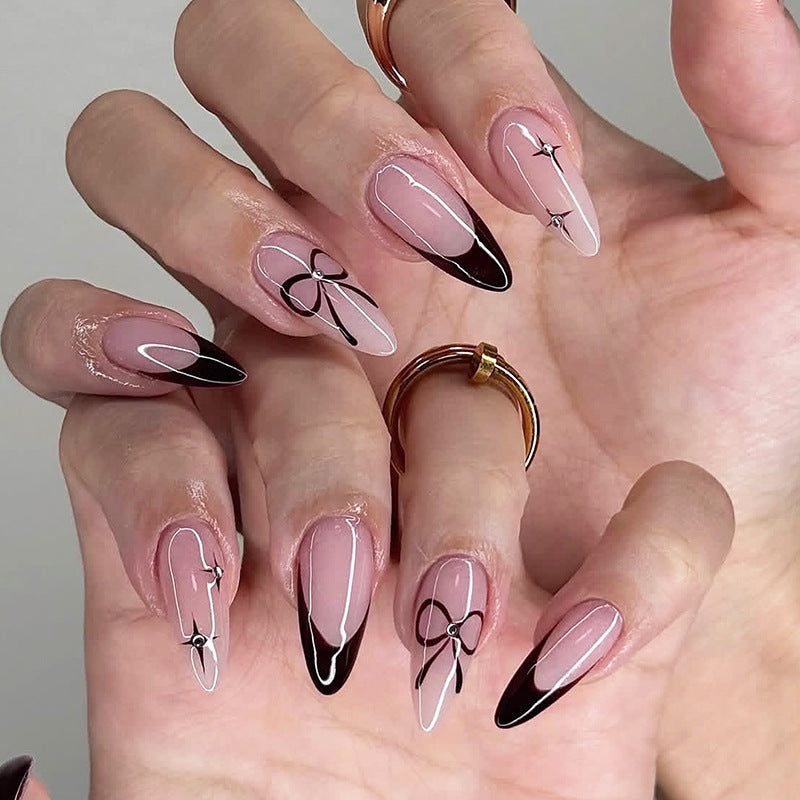 Artificial nail set with elegant cut and bow decorations Bowlift