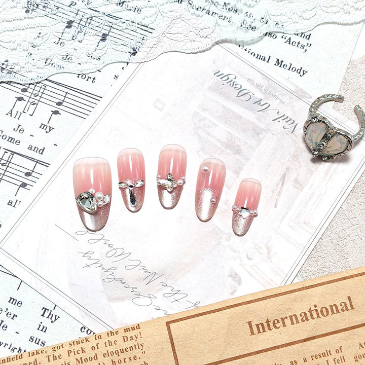 Artificial nails with luxurious jewelry accents Bowlift