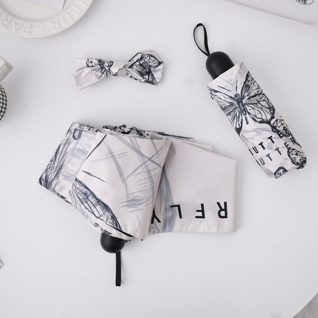 Women's fashionable folding umbrella with playful design Bowlift