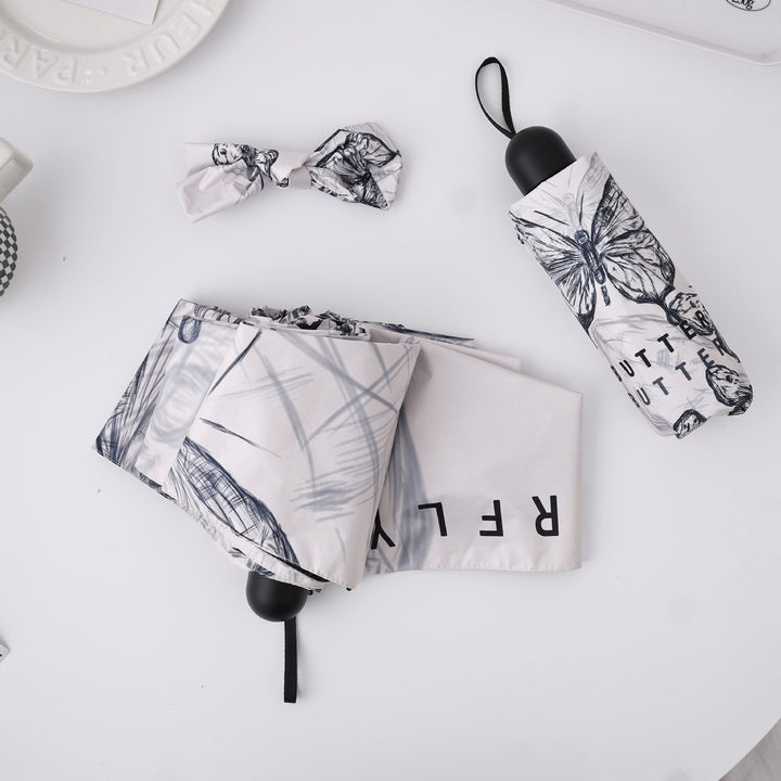 Women's fashionable folding umbrella with playful design Bowlift