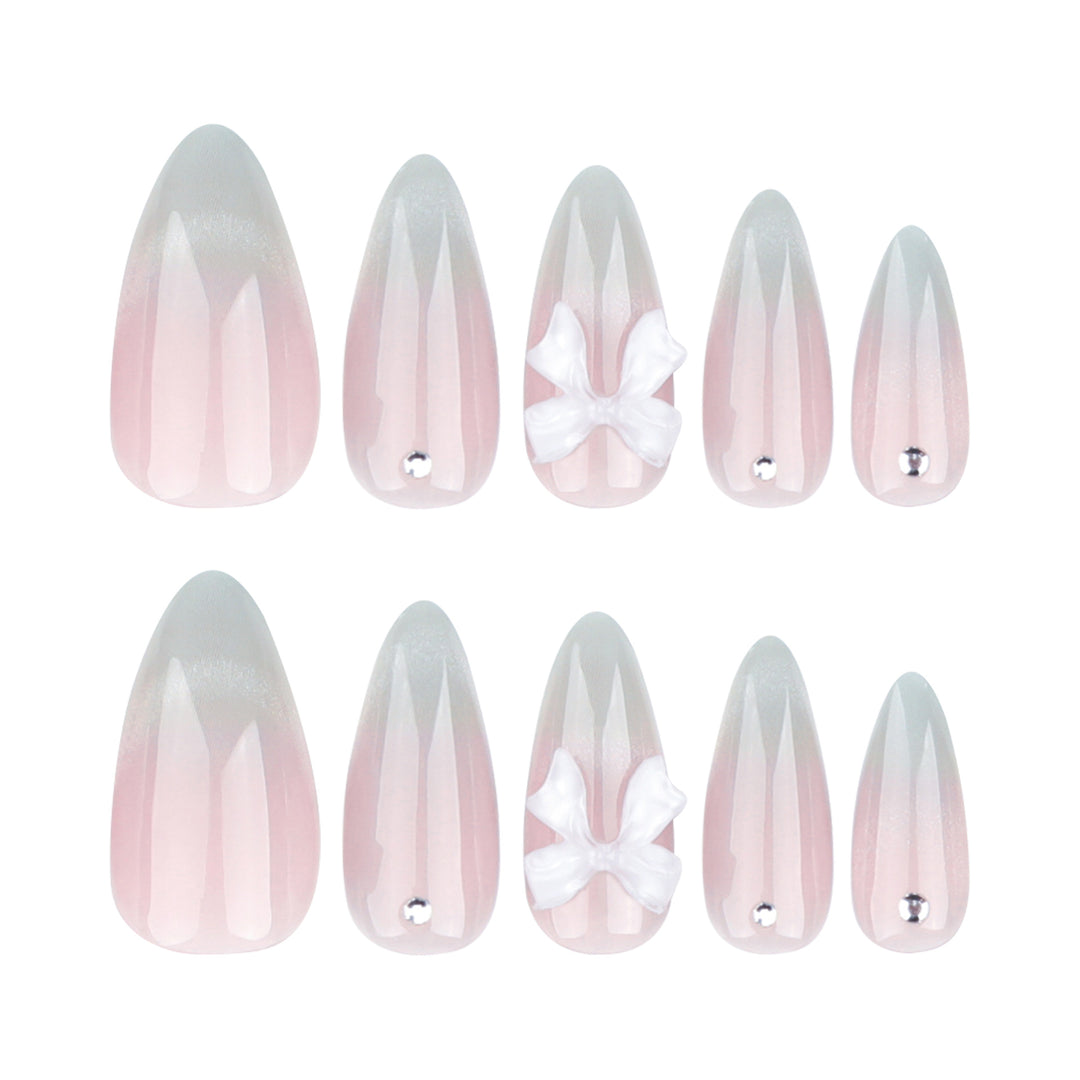 Elegant Stiletto Nails with Glitter and Bow Accents Bowlift