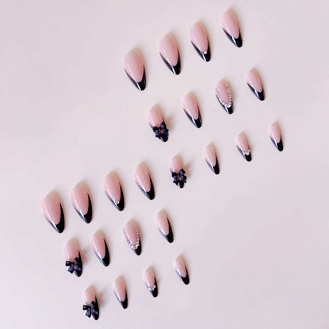 Artificial nail set with glamorous 3D bows and rhinestone embellishments Bowlift