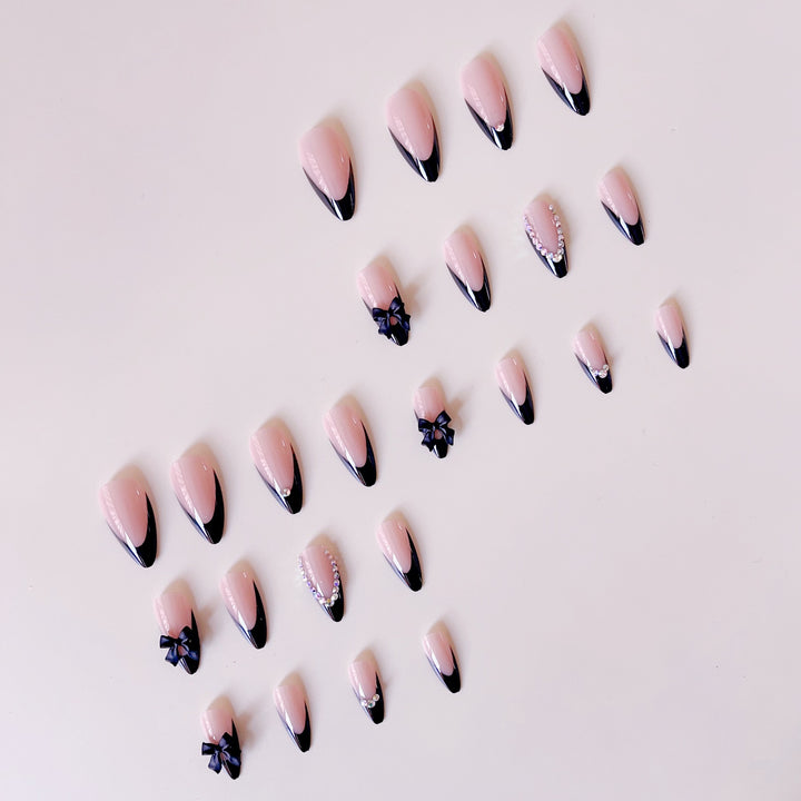 Artificial nail set with glamorous 3D bows and rhinestone embellishments Bowlift