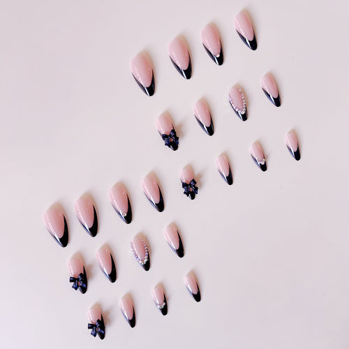 Artificial nail set with glamorous 3D bows and rhinestone embellishments Bowlift