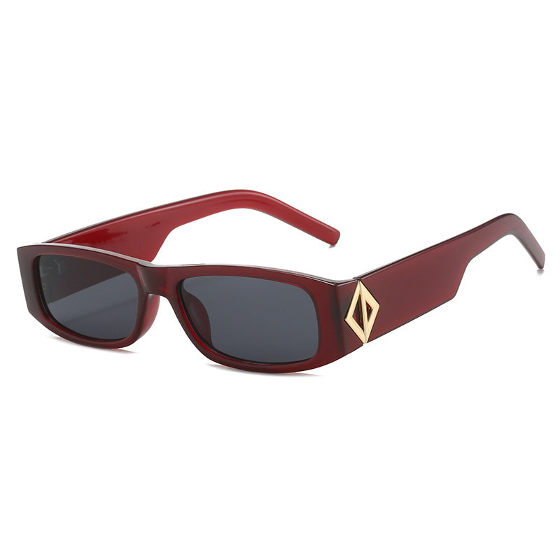 Ladies fashionable sunglasses with asymmetrical frame and gold-colored details Bowlift