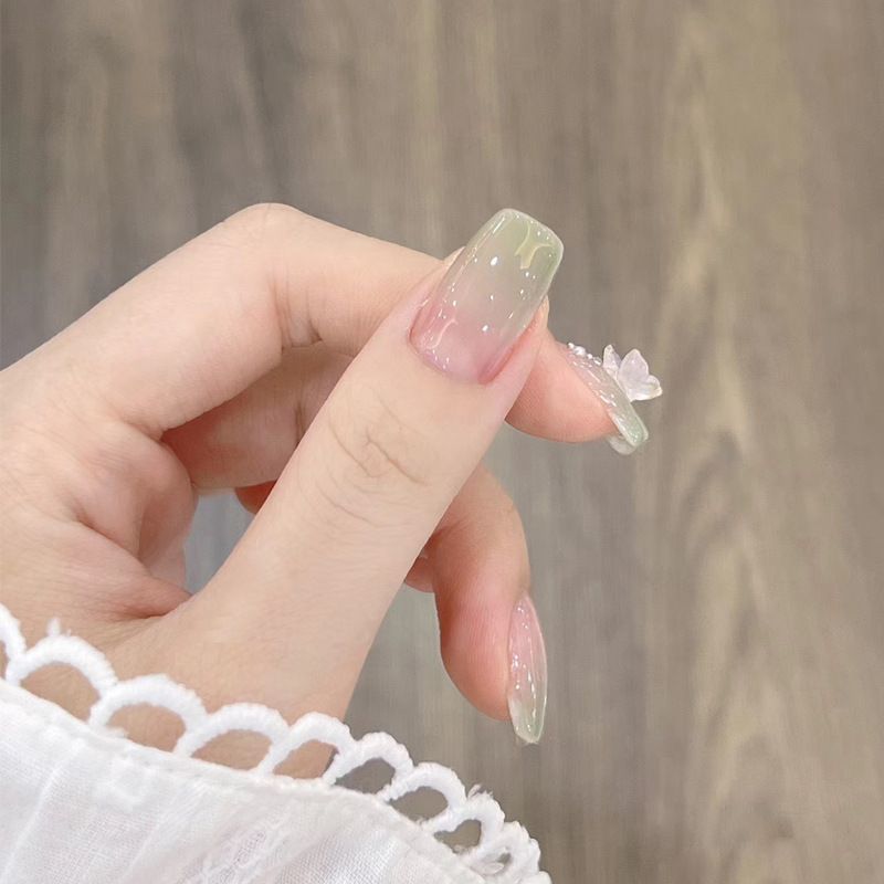 Artificial artificial nails with elegant ombre design and jewelry accents Bowlift