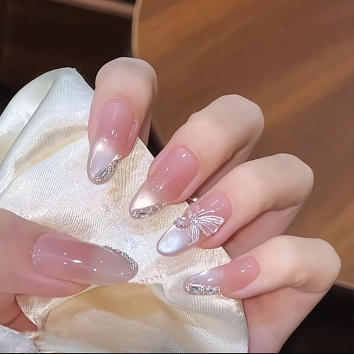 Artificial nail set with sparkling glitter accents Bowlift