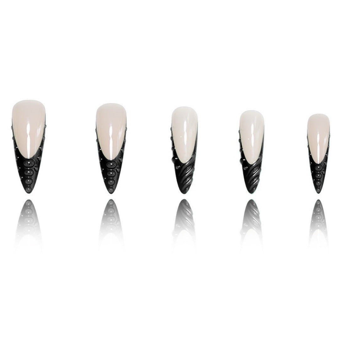 Artistic Stiletto Nail Extensions with Textured Detailing Bowlift