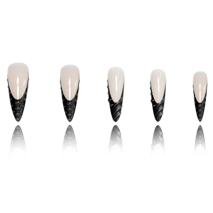 Artistic Stiletto Nail Extensions with Textured Detailing Bowlift