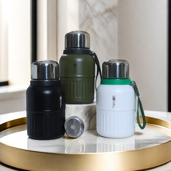 Insulated thermos bottle with practical drinking cup and sturdy carrying strap Bowlift