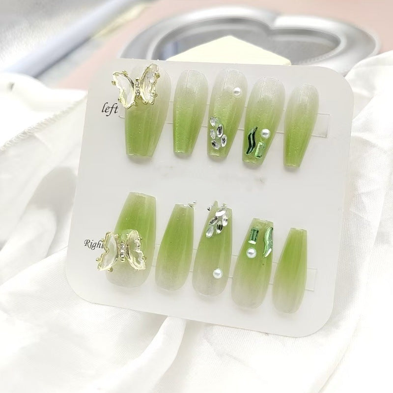 Artificial nails with butterfly accents and glitter details Bowlift