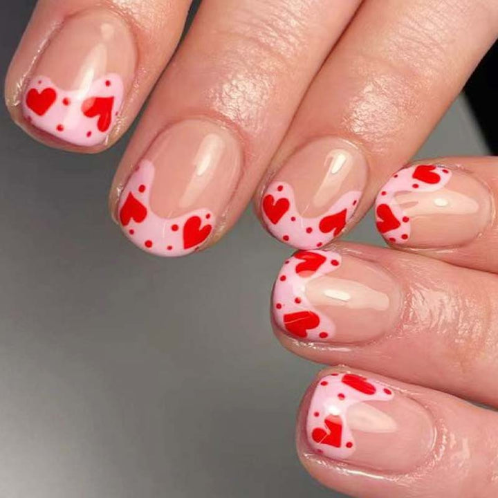 Artfully designed nail tips with heart motifs Bowlift