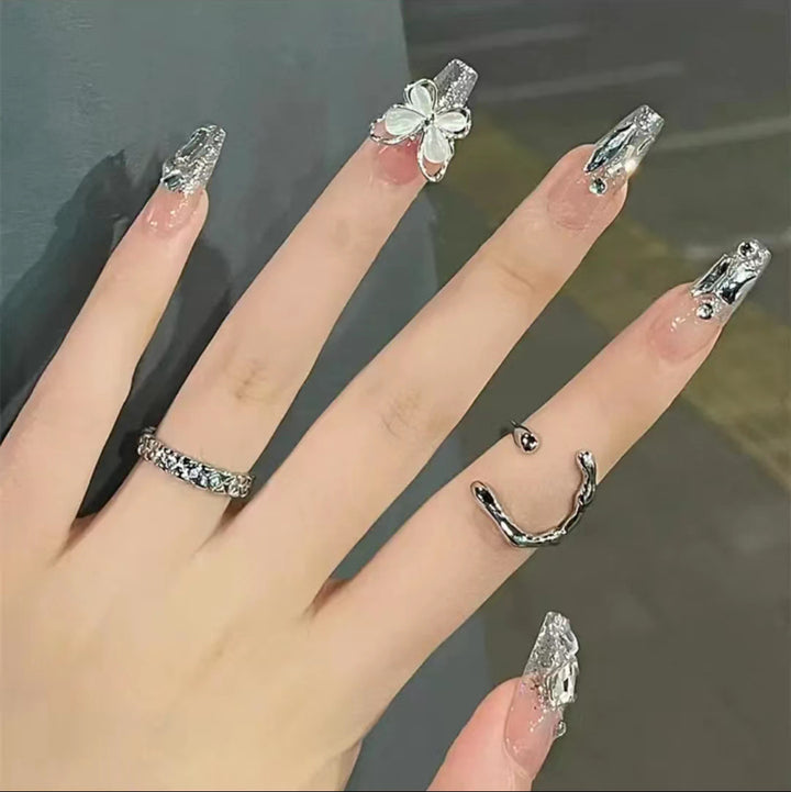 Artful Nail Art with Glitter and Butterfly Elements Bowlift