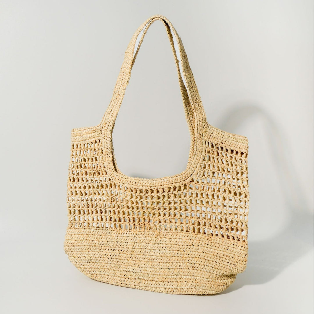 Hand-knotted raffia bag with generous interior Bowlift