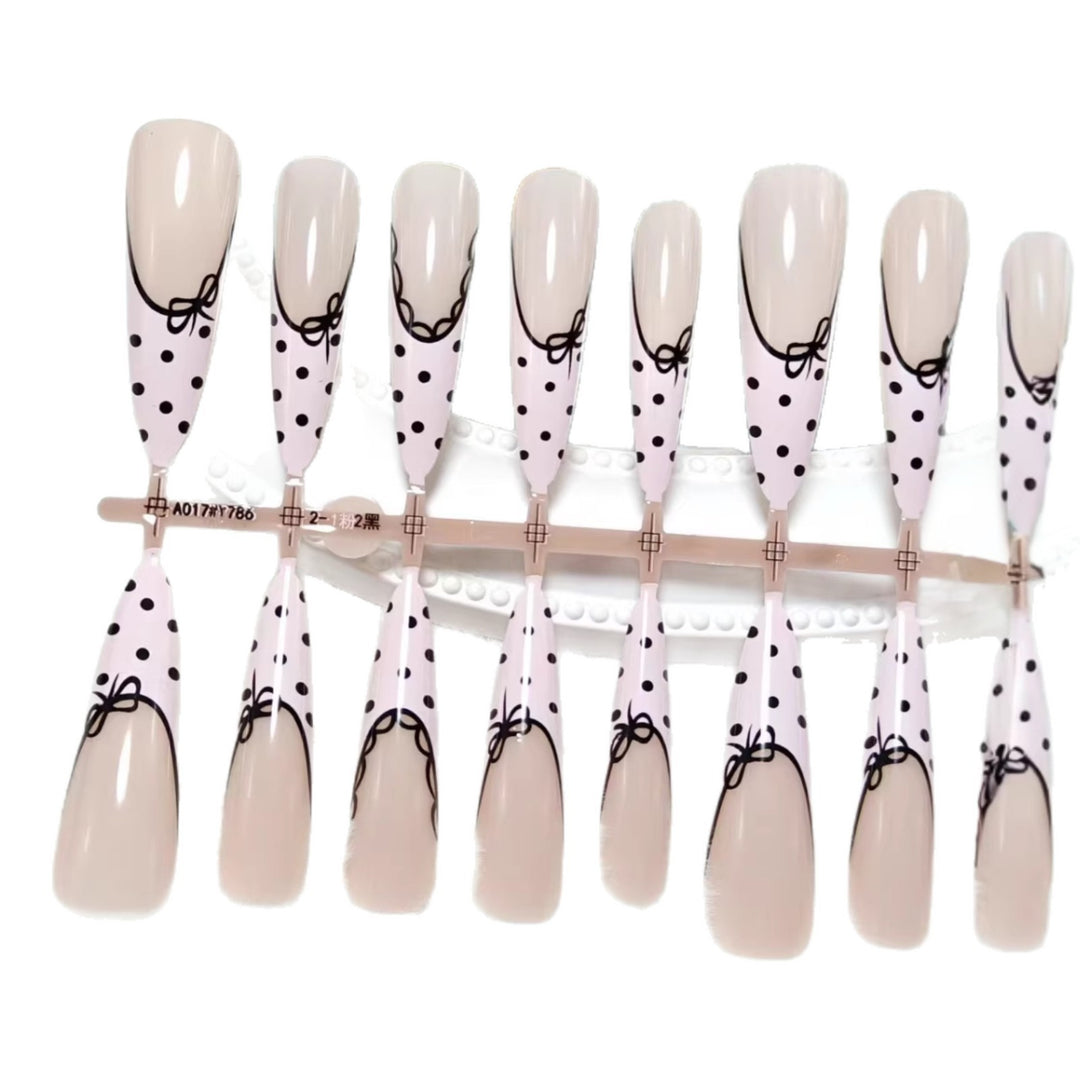 Elegant artificial nails with bow design and dots Bowlift
