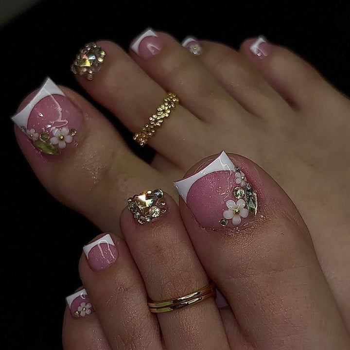 Artistic toenail art with elegant flower and glitter accents Bowlift