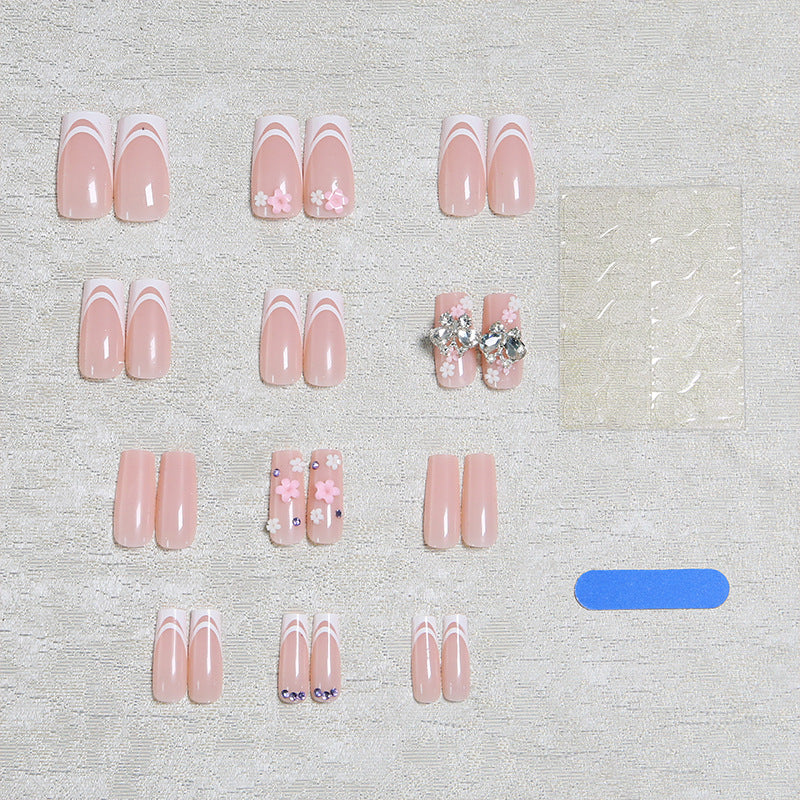 Artificial nails with floral accents and glitter effects Bowlift