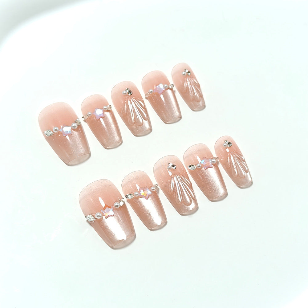 Exquisite artificial nails with glitter and pearl accents Bowlift