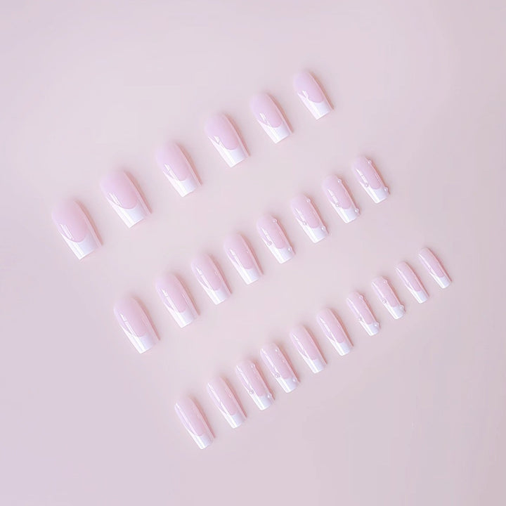 Artificial nail tips with elegant pearl accents Bowlift