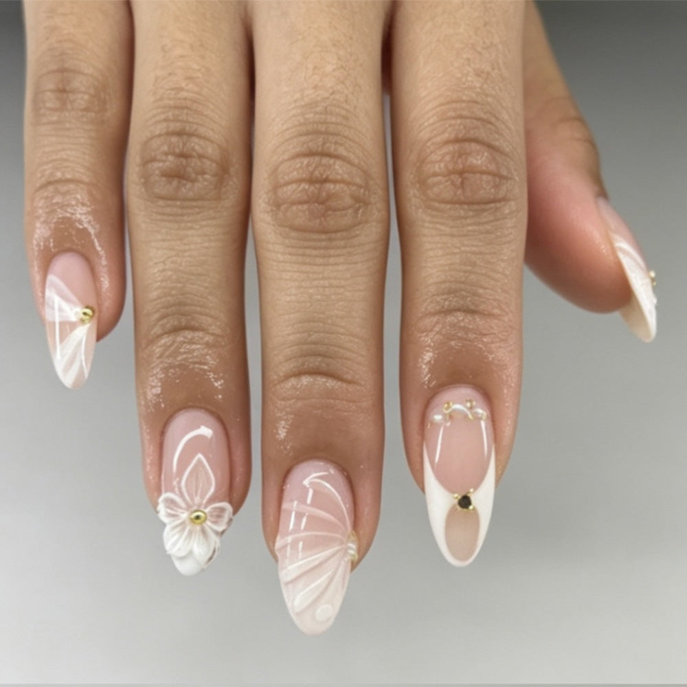 Artificial nails with elegant flower design and glitter accents Bowlift