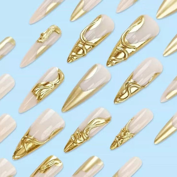 Artificial nails with golden, curved accents Bowlift