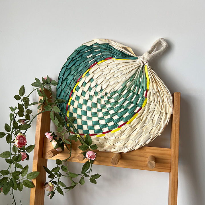 Women hand-woven fan made of natural material Bowlift