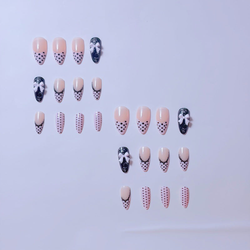 Elegant artificial nails with lace design and bow accents Bowlift